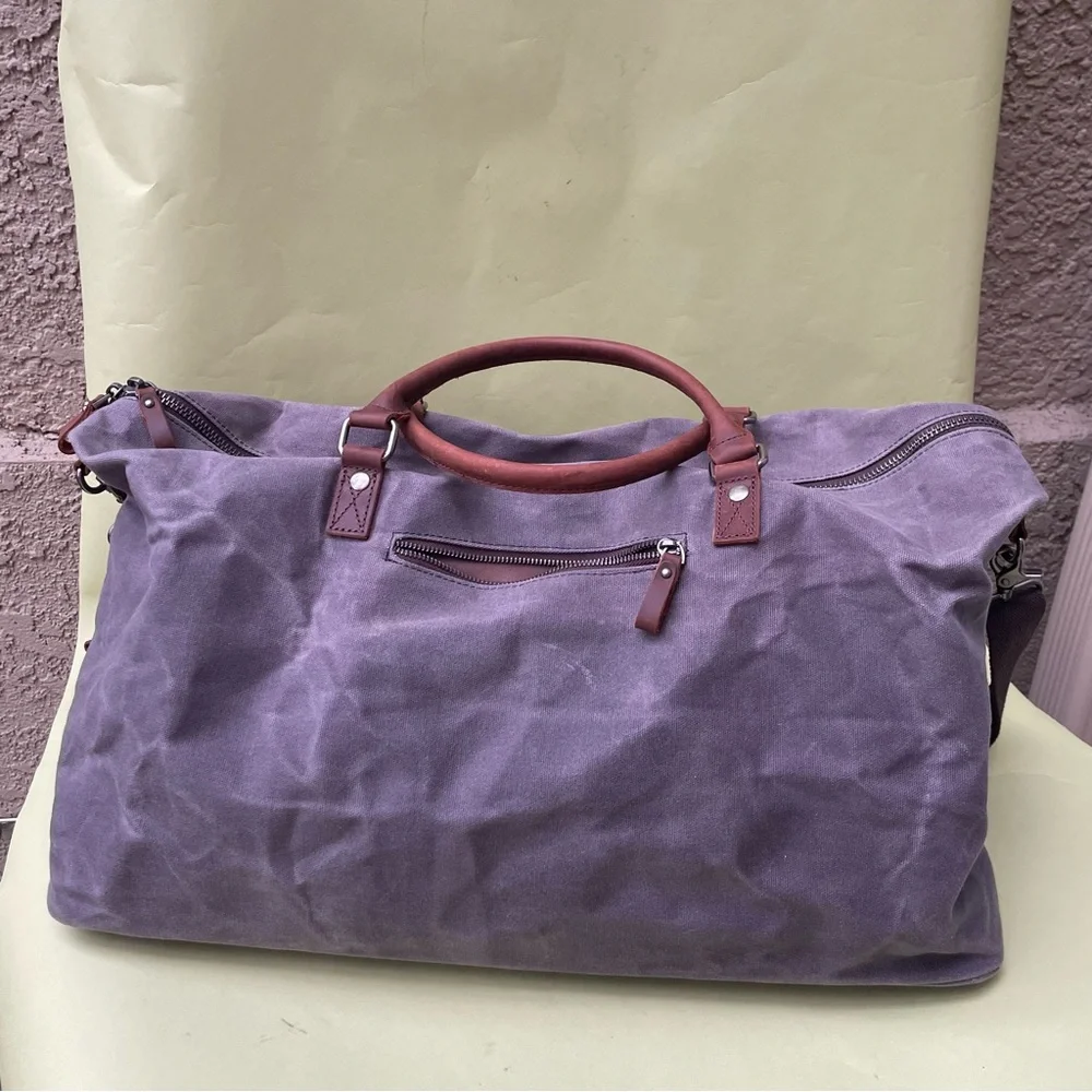 Grayish brown cotton/leather travel bag